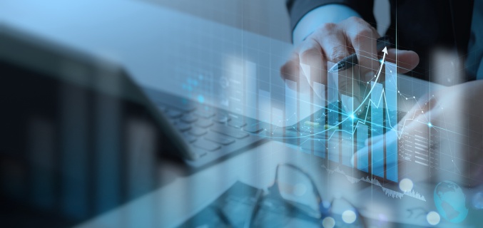 Person using a tablet with overlaid financial graphs and data visualizations indicating revenue growth.