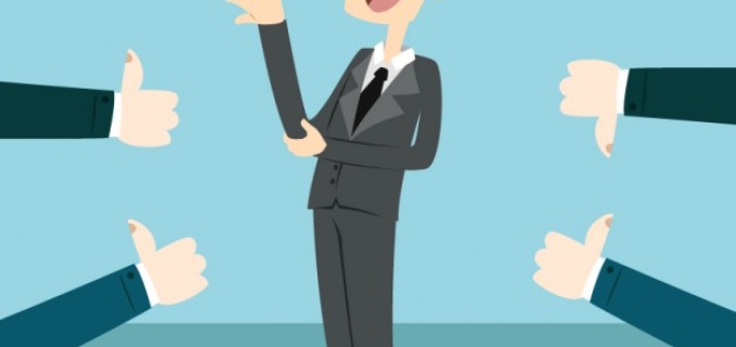 A man speaks and gets a thumbs up or down rating
