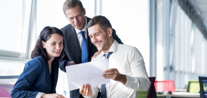 Buisness people talking about a file 