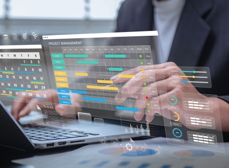 Business professional interacting with a futuristic digital interface displaying project management tools, including Gantt charts, calendars, progress bars, and task lists.